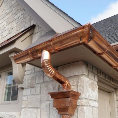 homeguide-up-close-view-of-sectional-copper-gutters-installation Copper and Steel Gutters
